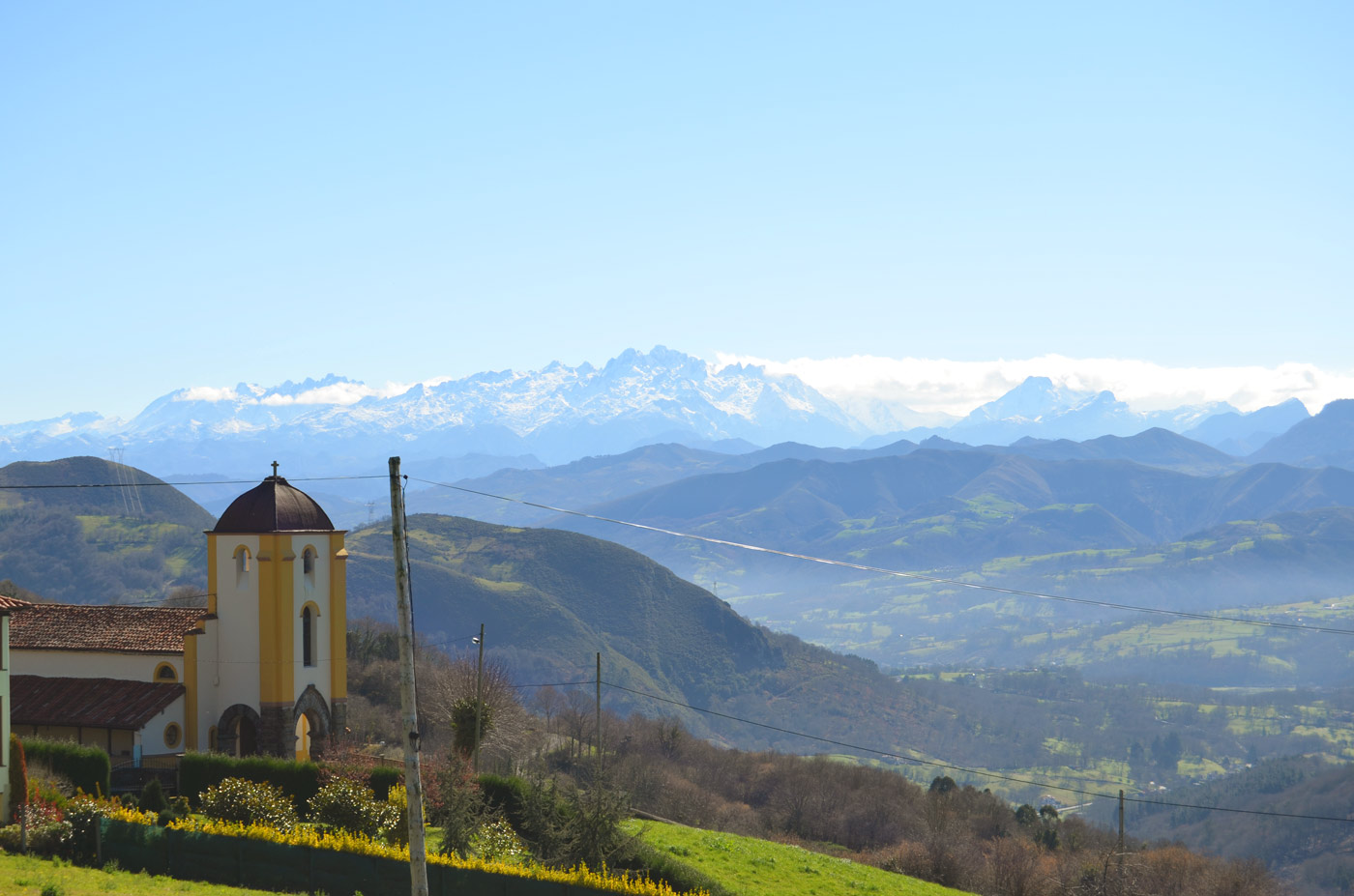 Villlage church and Picos de Europa
