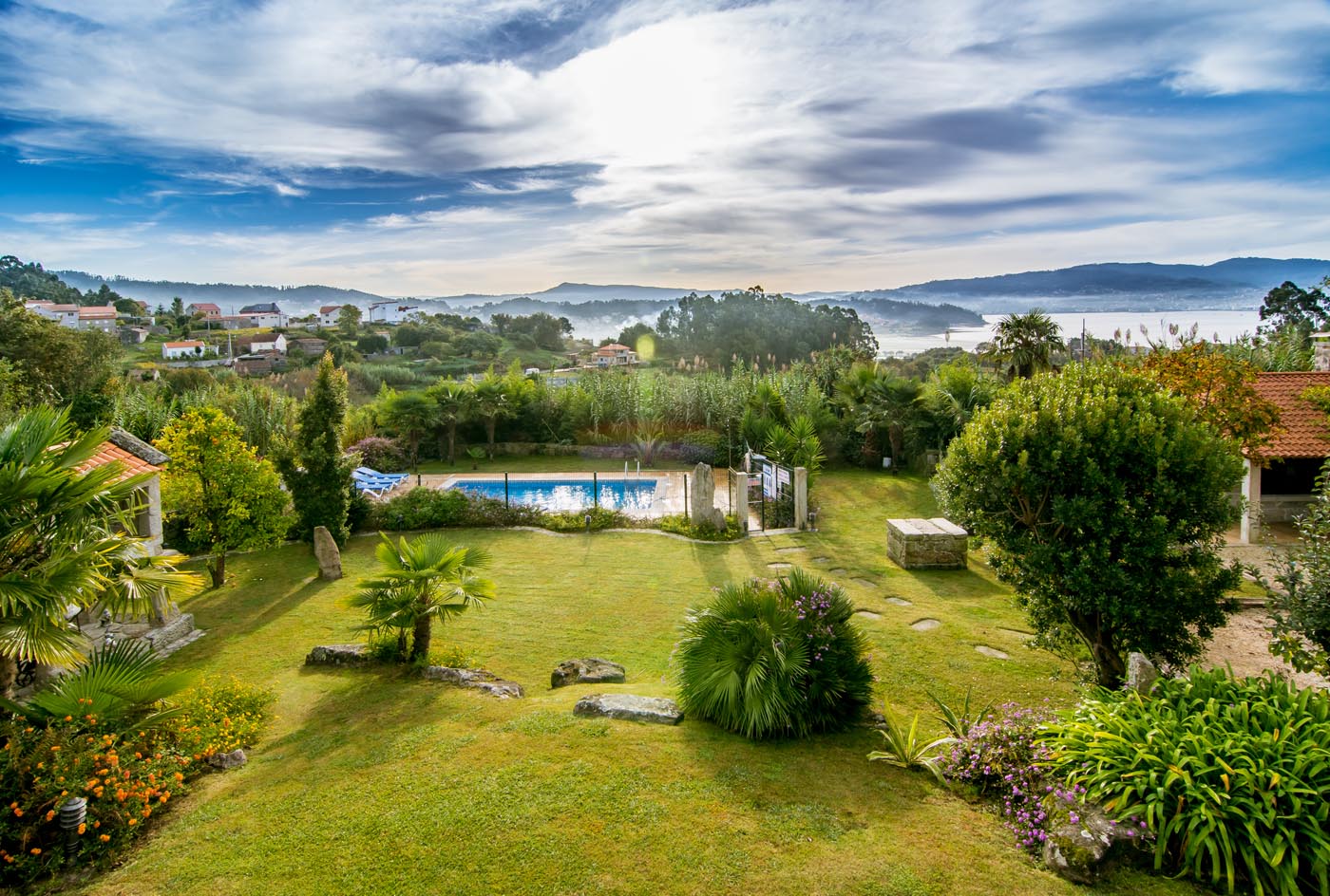 Gardens, pool & estuary in the distance