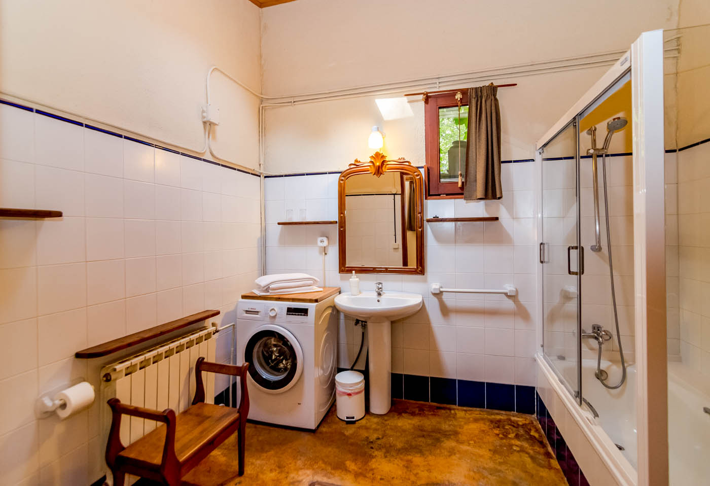 Bathroom with tub and shower over