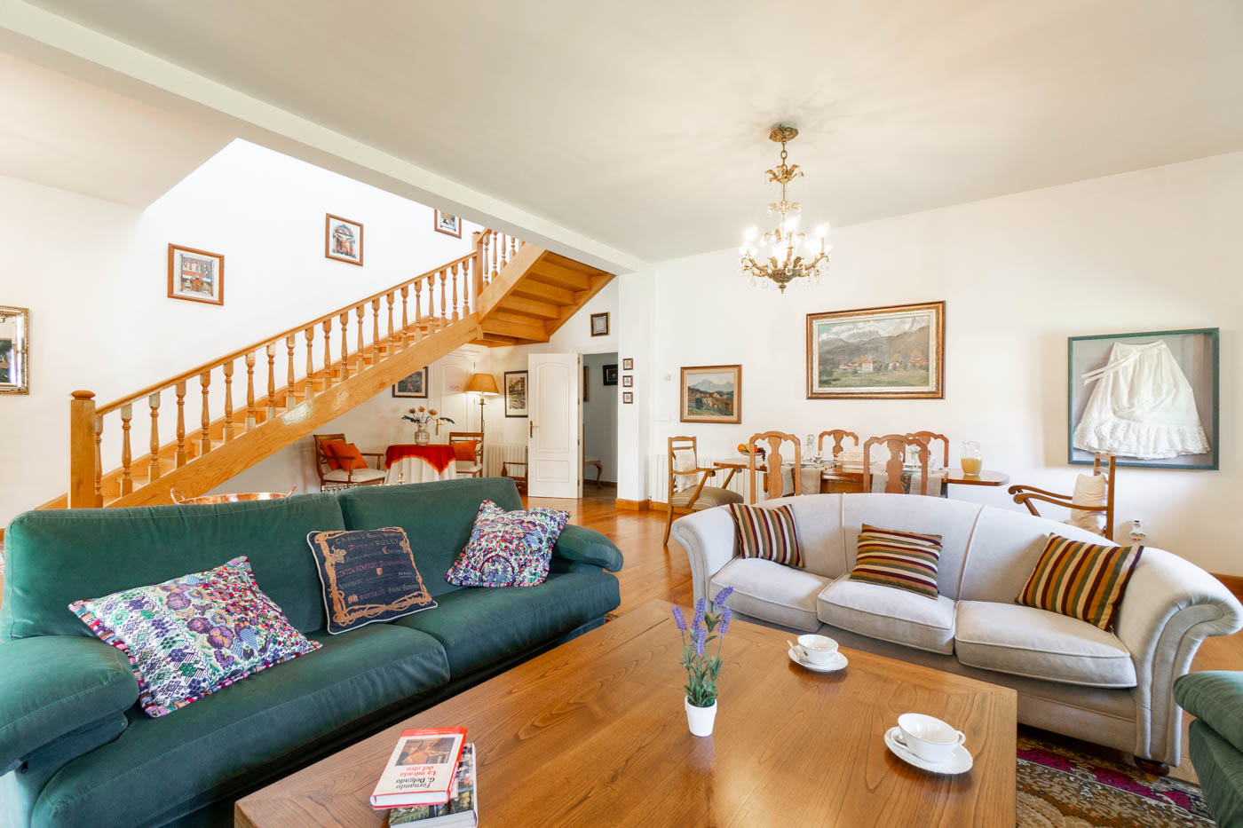 Large living area, dining table and stairs to 1st floor