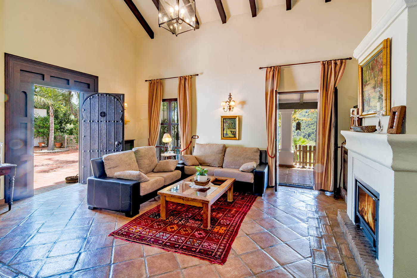 Lounge with doors to terraces and porch