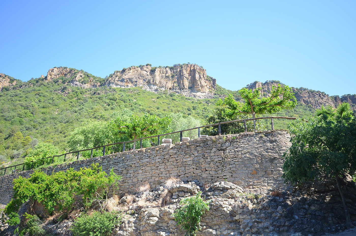 Wire fenced pool area seen from parking area