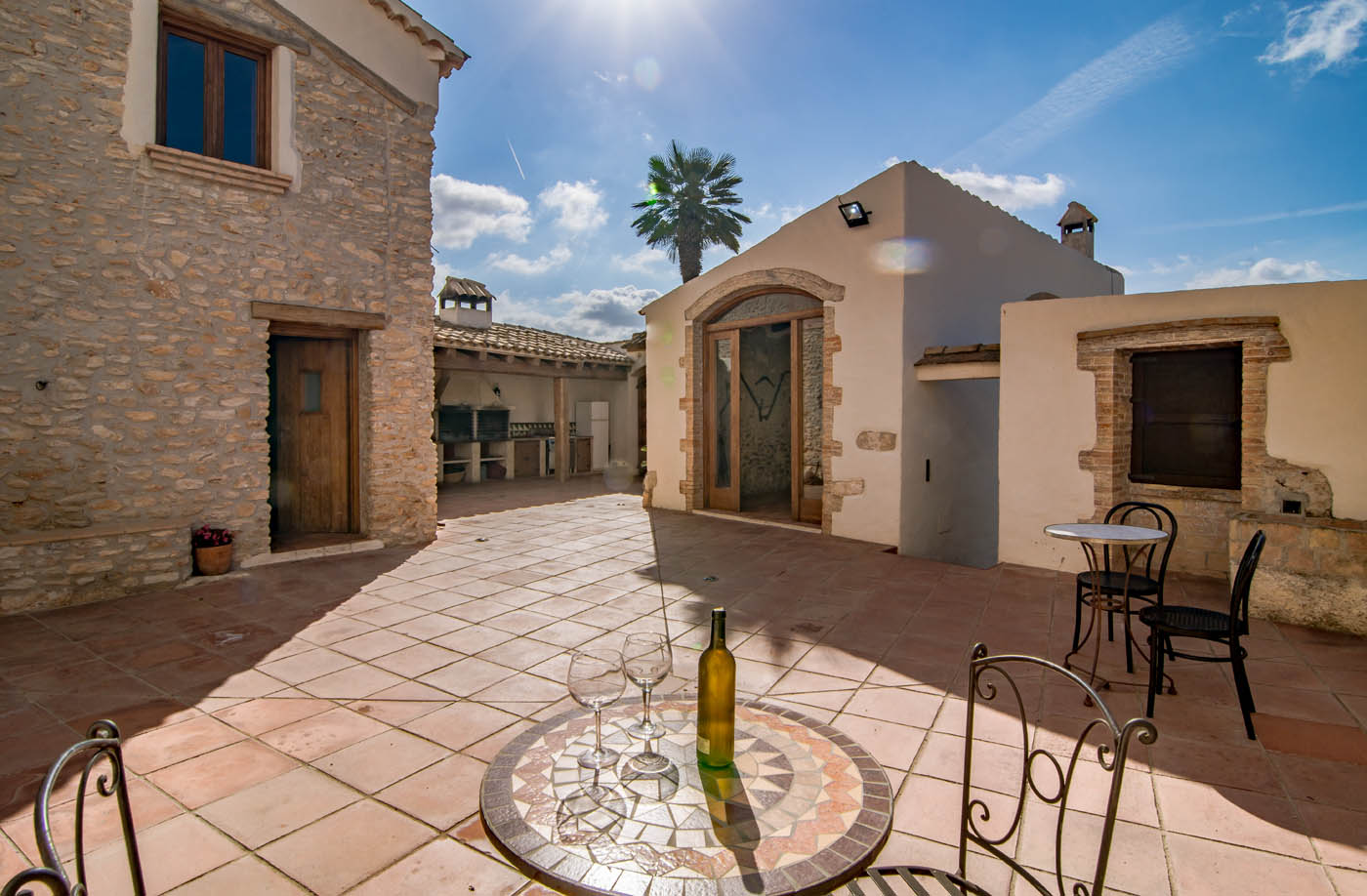 Main patio leads to house, pool, outdoor dining room