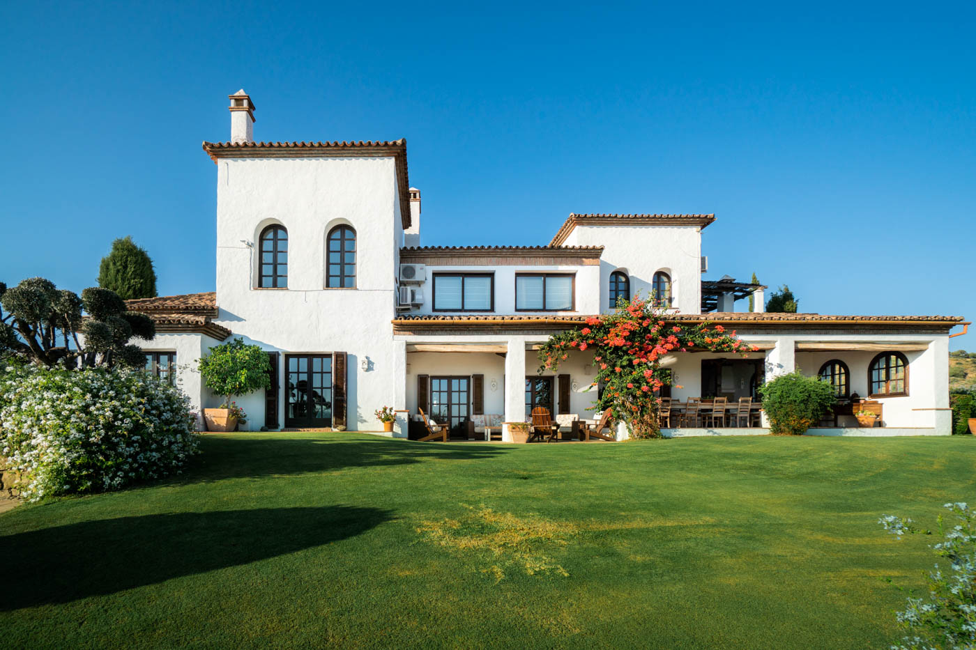 Villa seen from gardens next to pool