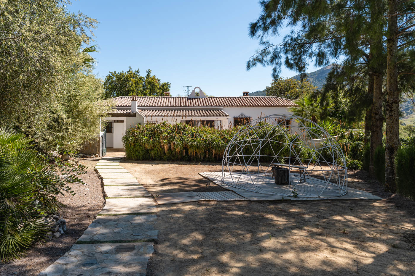 Path from pool to villa