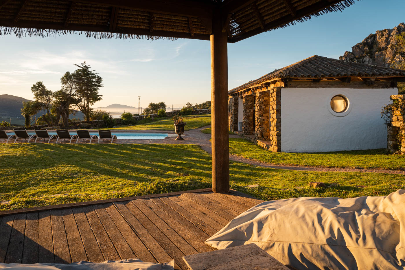 Views to pool and porch with Morocco as backdrop 
