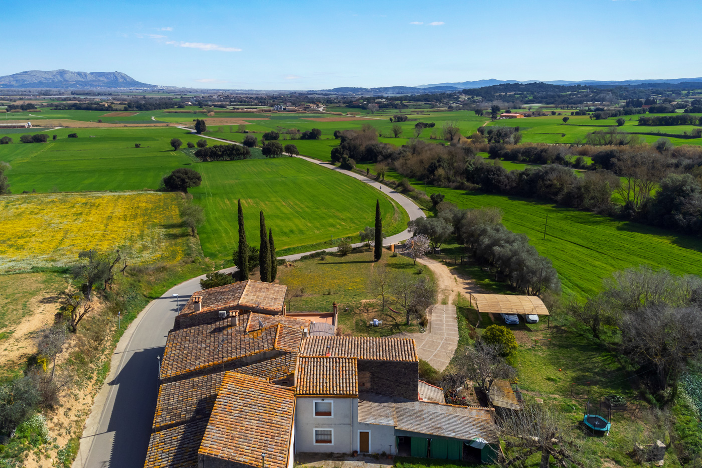 Just outside a village but surrounded by countryside