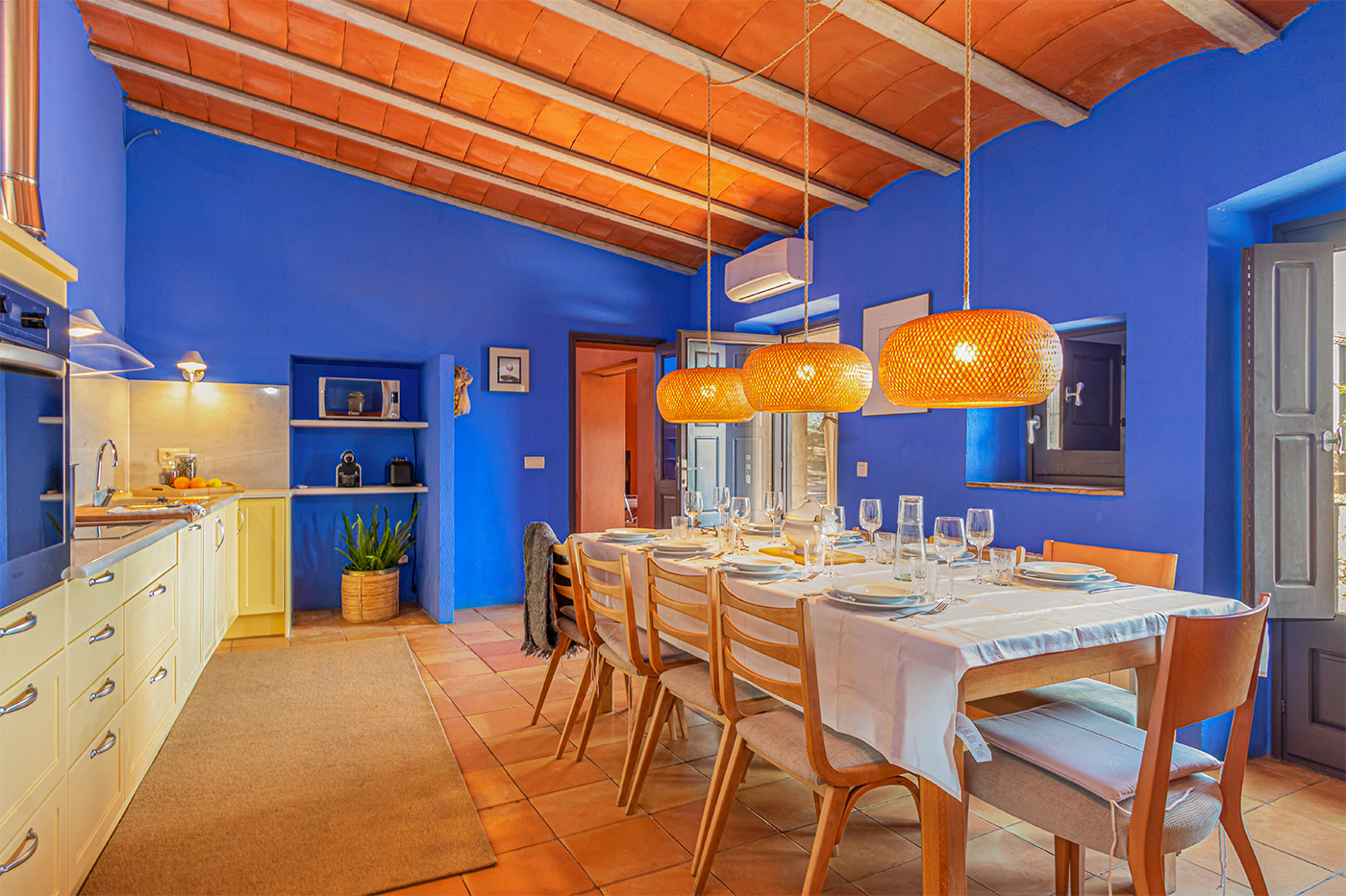 Lovely kitchen with doors to terraces and views