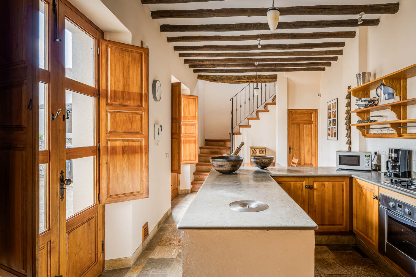 Great kitchen with doors to barbecue patio