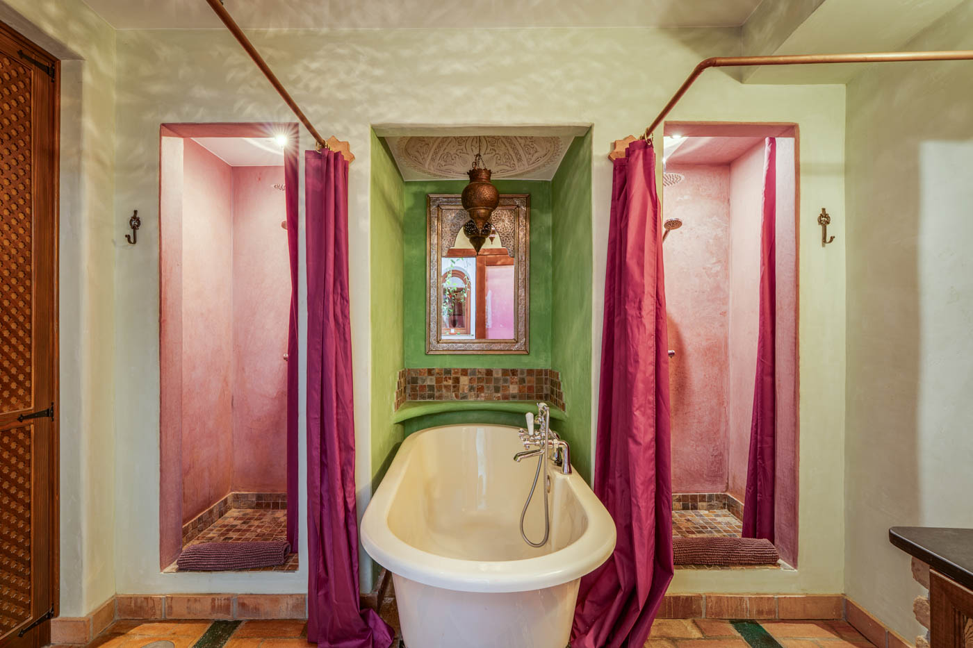 Ground floor bathroom with walk-in showers and bathtub