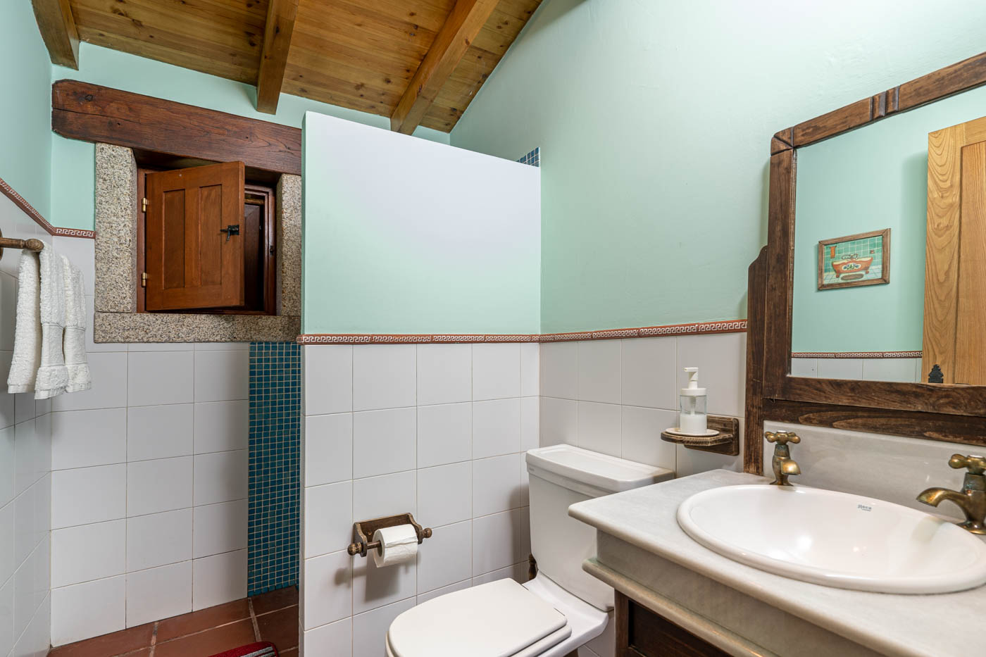 Bedroom 3's bathroom is just outside in the hallway