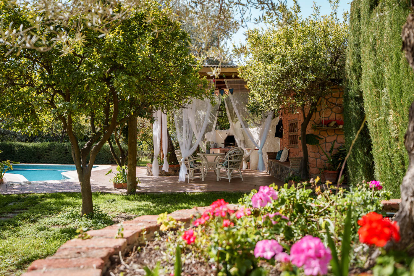Porch, pool and gardens