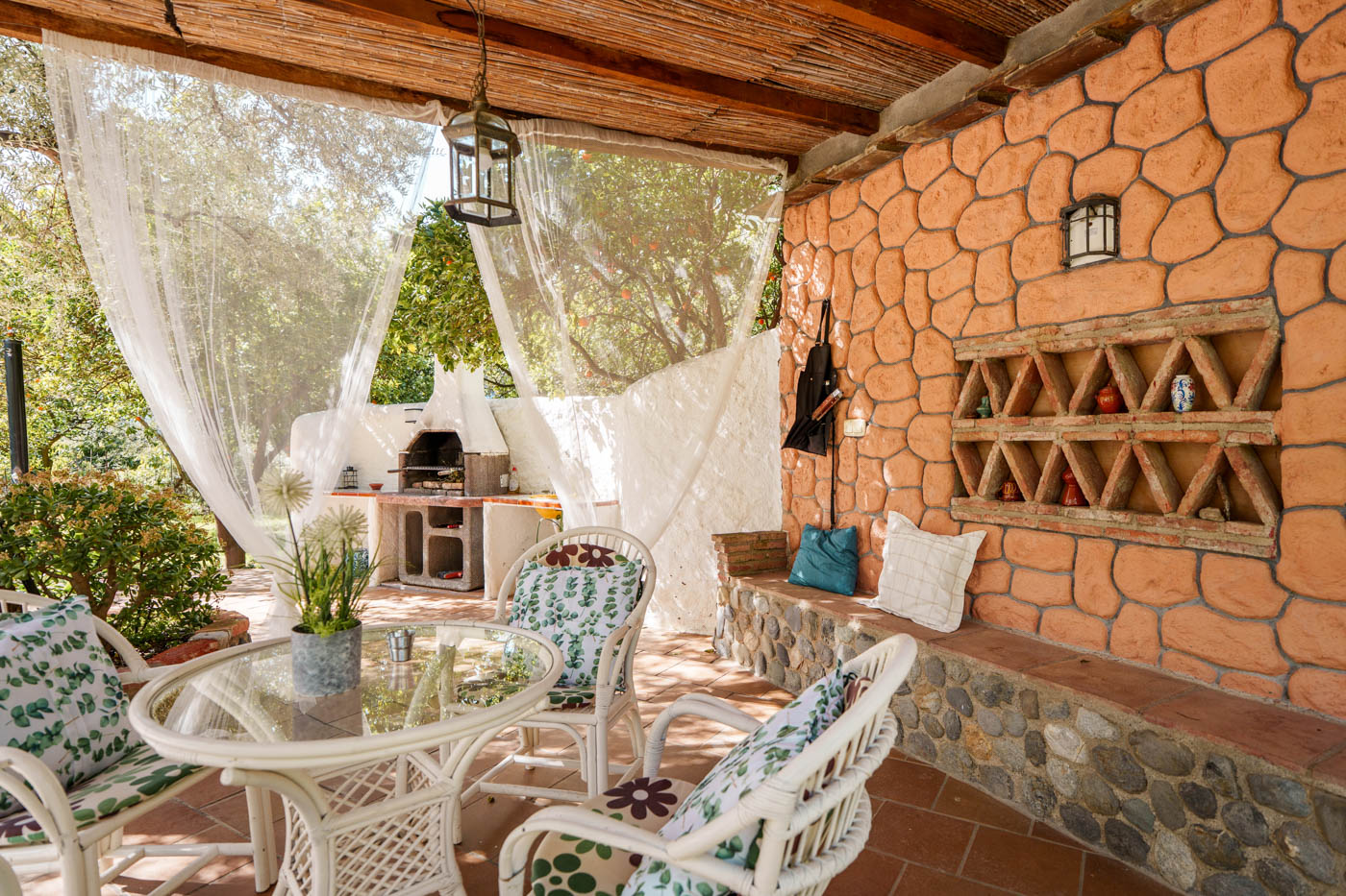 Furnished porch next to barbecue area