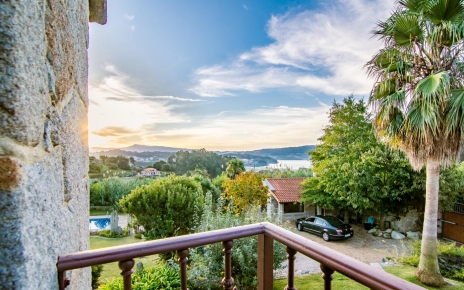 View from the Villa to the garden, summer house and pool