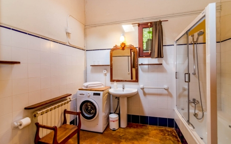 Bathroom with tub and shower over