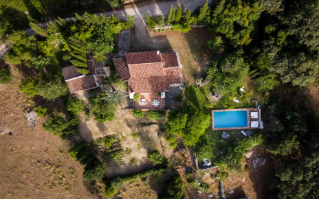 Villa, gardens and pool seen from above