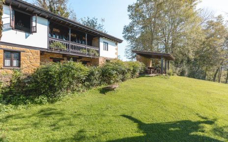 On the edge of village, stands on its own grounds