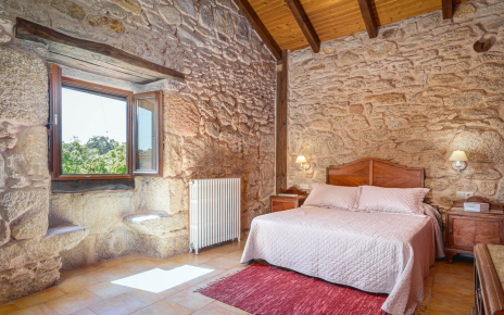 Bedroom 3 is spacious and stone-walled