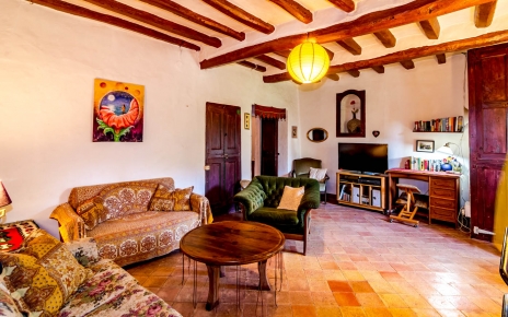 Flat TV and desk with some books