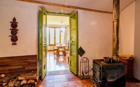 Reception to kitchen from bedrooms with wood burner