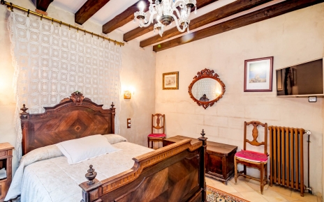 This bedrooms has its own TV