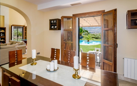 Doors opening to gardens and pool area