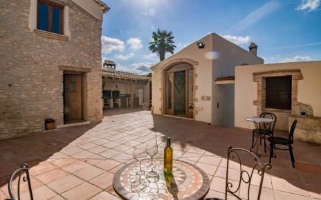 Main patio leads to house, pool, outdoor dining room