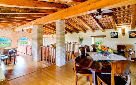 Attic room has additional tables with chairs
