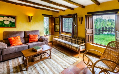 Living space with large windows looking onto private gardens