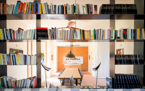 Dining area with kitchen seen from library
