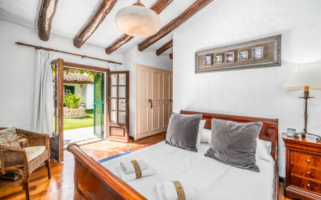 East Wing bedroom with doors to courtyard garden