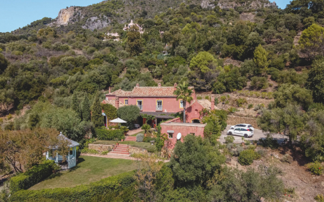 Villa with gardens and parking area