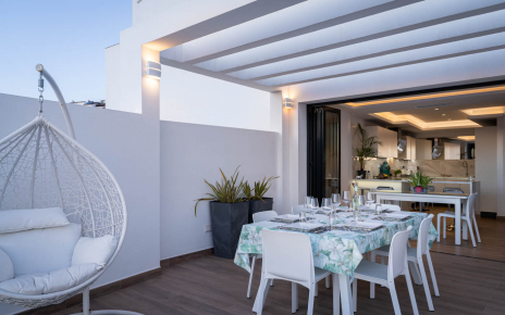 The outdoor dining area is directly next to kitchen