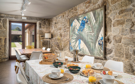 Dining area with doors opening to gardens
