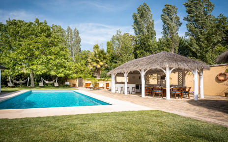 Pool area with furnished shaded areas