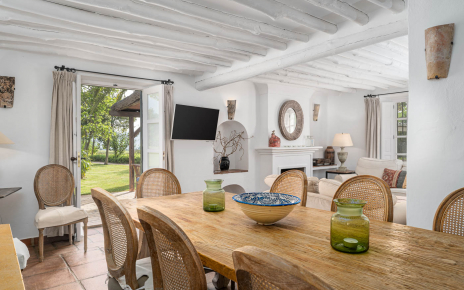 Dining / living area with doors opening to gardens