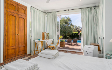 Ground floor bedroom with doors to pool terrace