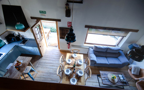 Open plan kitchen/dining/living seen from gallery room