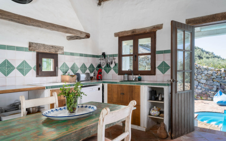 Kitchen with door to pool area