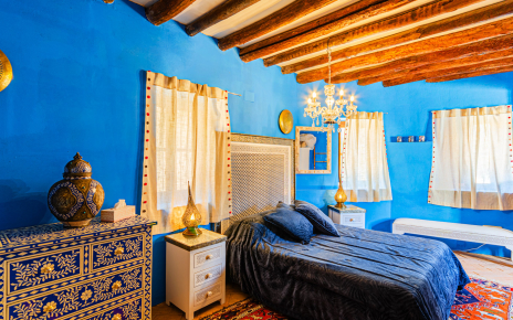 Ground floor bedroom with doors to pool area/terrace