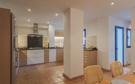 Kitchen/dining area with access to pool and patio