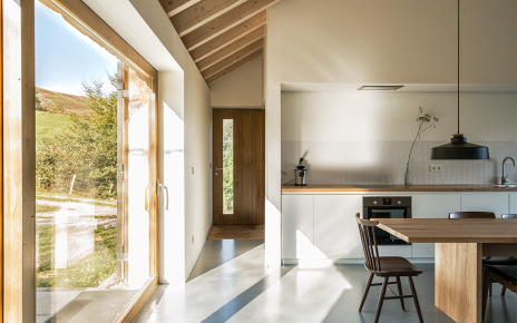 Kitchen / dining with sliding doors opening to gardens