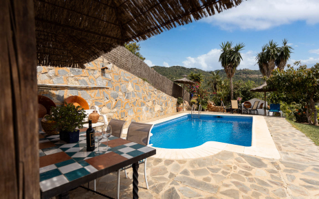 Furnished pergola next to swimming pool