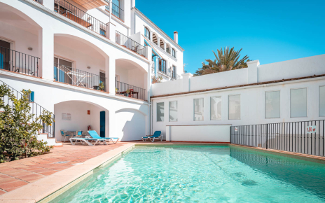 The apartment is on a lower level, below the pool