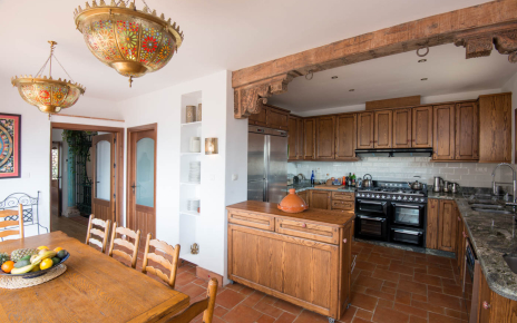 Kitchen / dining area with doors opening to large terrace