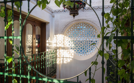 Inside, both floors are arranged around central Moroccan patio