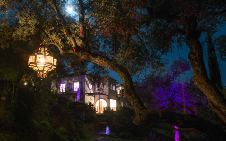 A vibrant villa, glowing with charm day and night