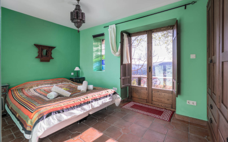 Bedroom set as a double with doors to terrace