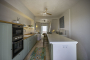A lovely kitchen with doors opening to terrace